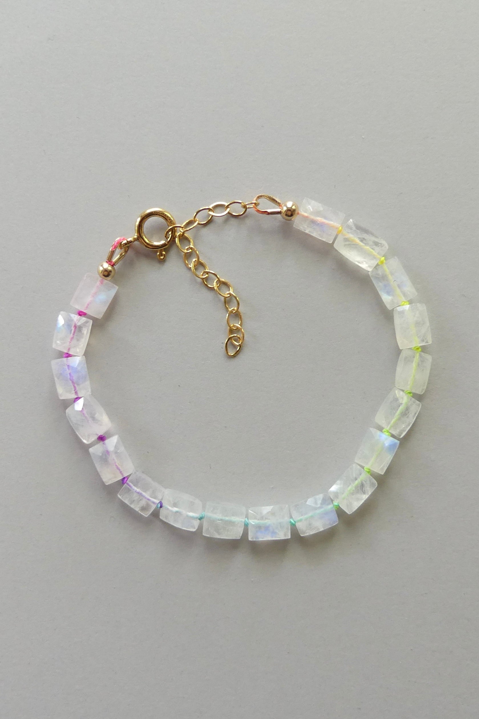 Adjustable rainbow moonstone bracelet with cube beads, hand-knotted on neon silk and finished with gold-filled extender clasp