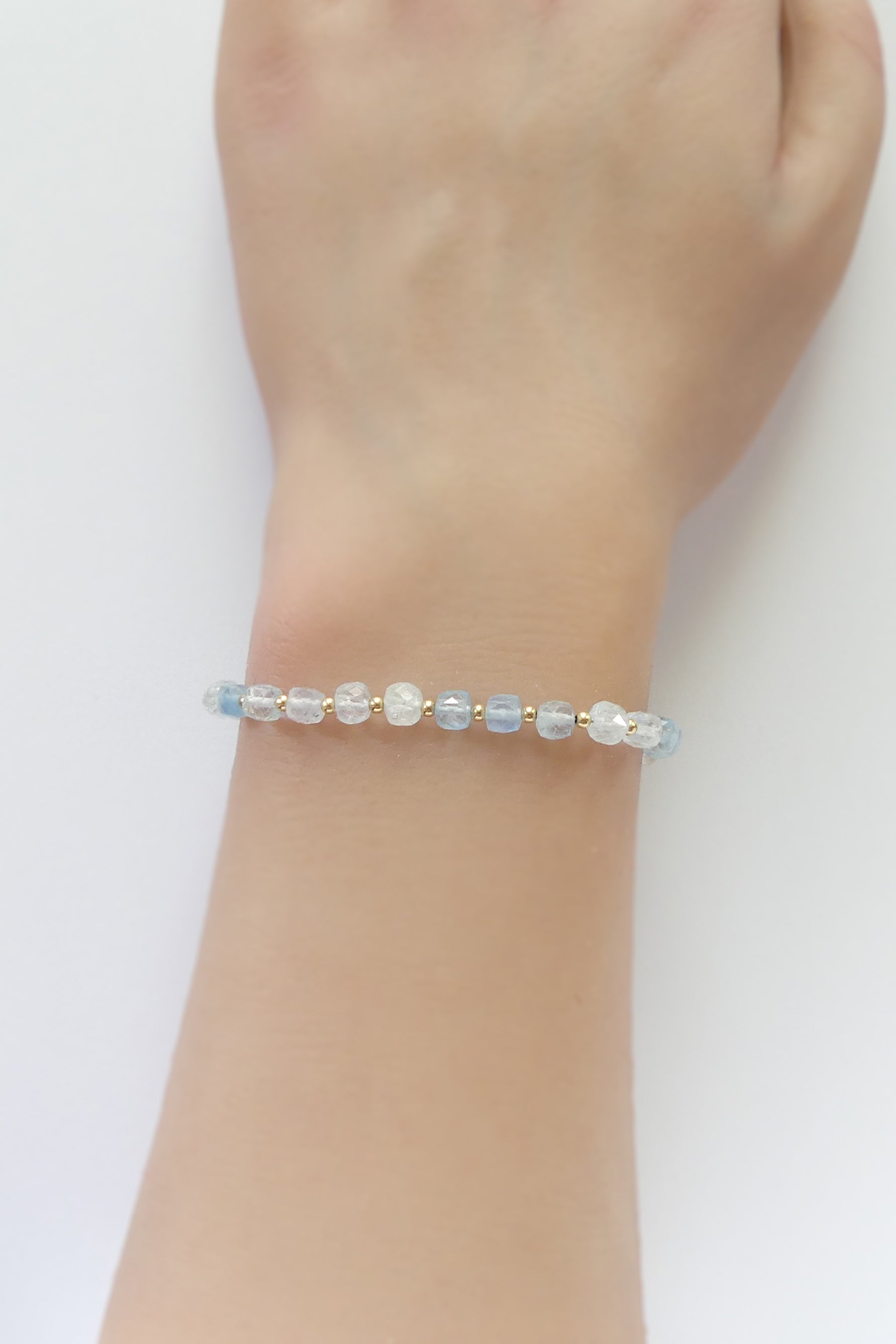 Dainty aquamarine cube bracelet with 4mm faceted blue gemstones and gold-filled clasp, minimalist March birthstone healing jewelry