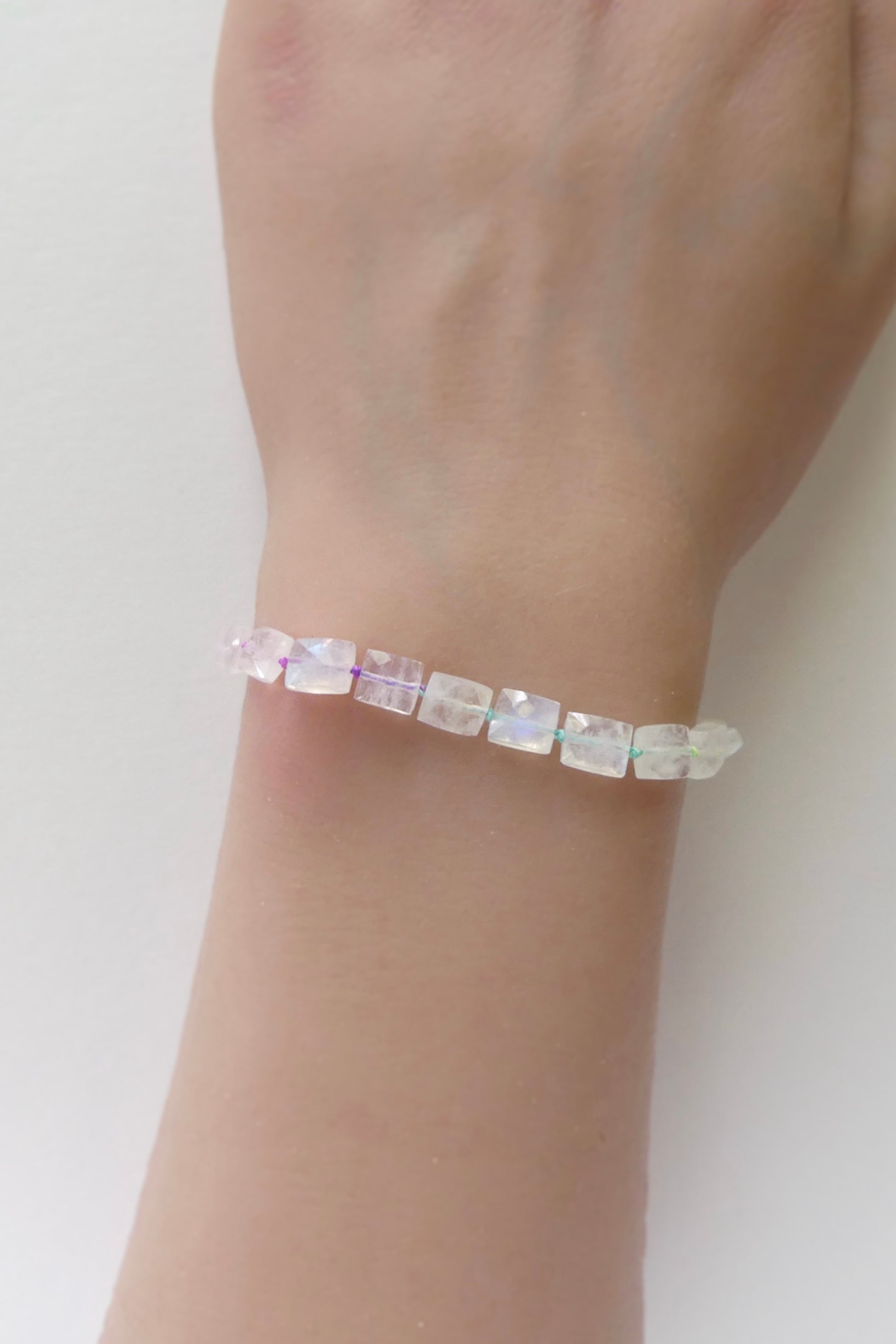 Adjustable rainbow moonstone bracelet with cube beads, hand-knotted on neon silk and finished with gold-filled extender clasp